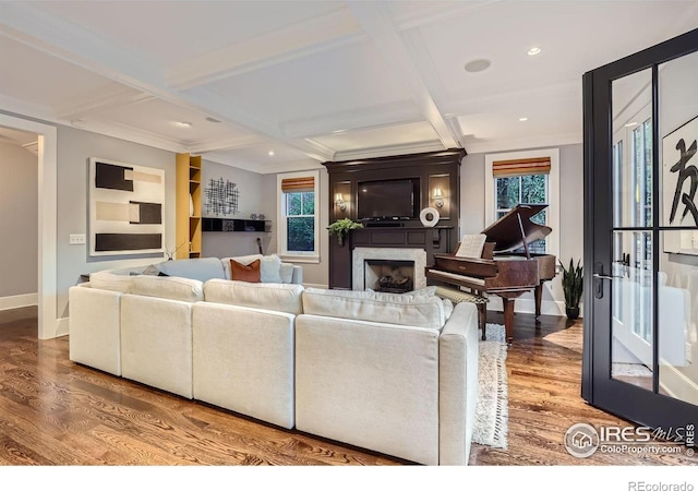 living room featuring beam ceiling, coffered ceiling, and hardwood / wood-style flooring