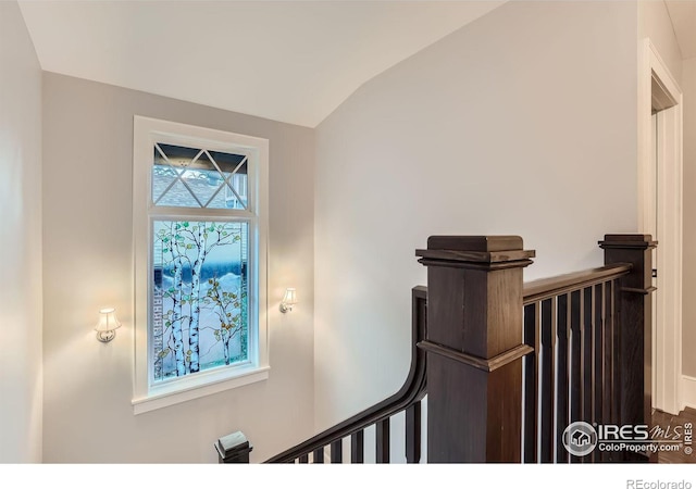 staircase with vaulted ceiling