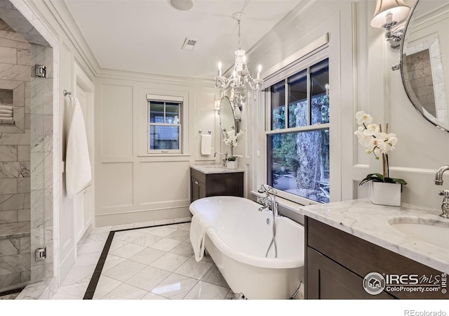 bathroom with an inviting chandelier, plus walk in shower, and vanity