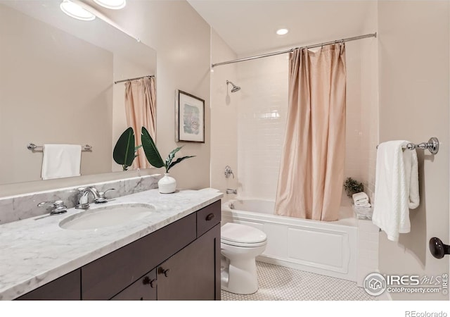 full bathroom featuring toilet, tile patterned flooring, vanity, and shower / bathtub combination with curtain