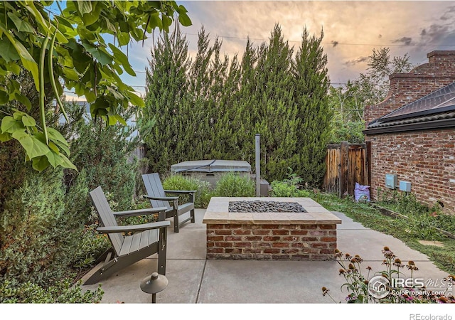 patio terrace at dusk with an outdoor fire pit