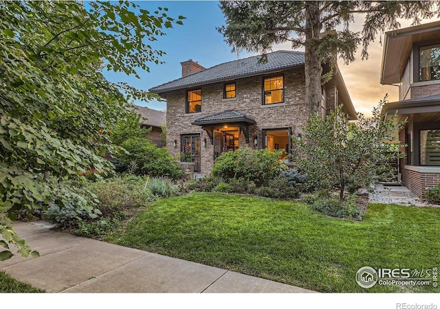 view of front of house with a yard