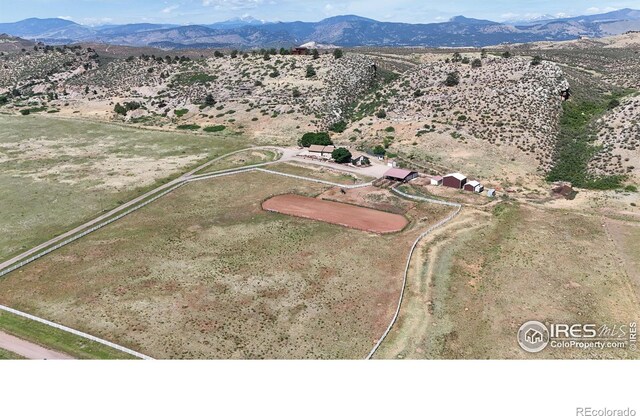 drone / aerial view featuring a mountain view