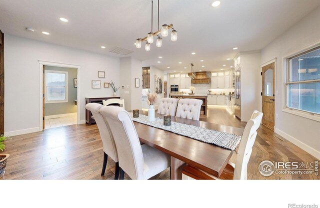 dining area with light hardwood / wood-style flooring