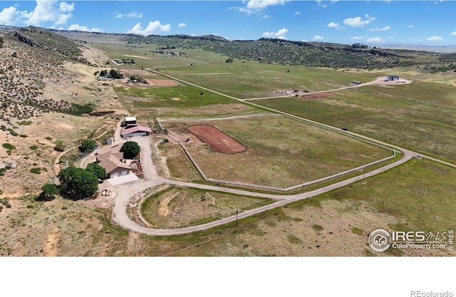 bird's eye view featuring a rural view and a mountain view