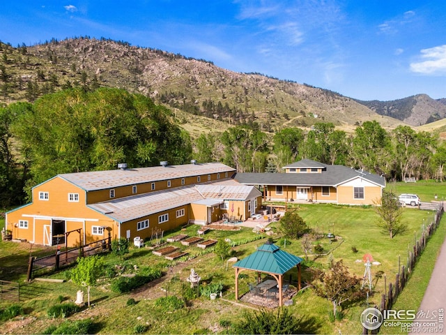 birds eye view of property with a mountain view