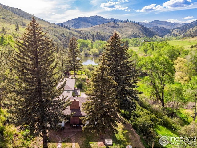 bird's eye view featuring a water and mountain view