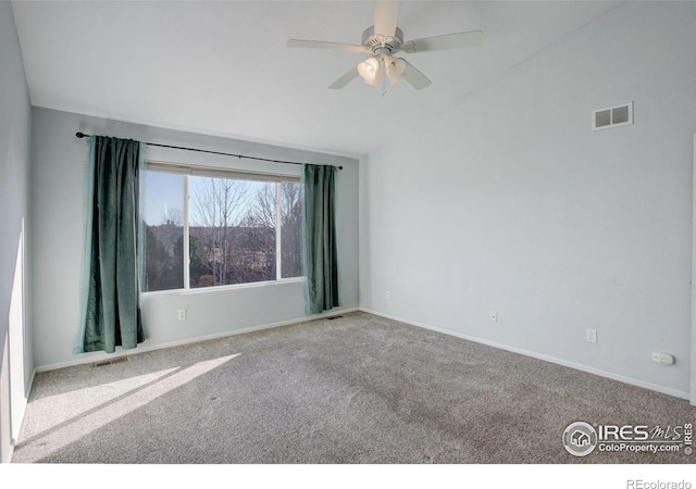 carpeted empty room featuring ceiling fan