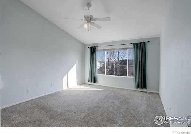 unfurnished room featuring carpet floors, ceiling fan, and vaulted ceiling