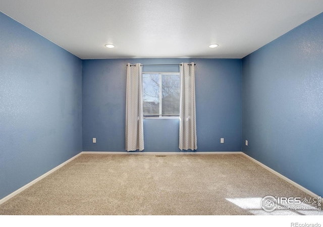 view of carpeted spare room