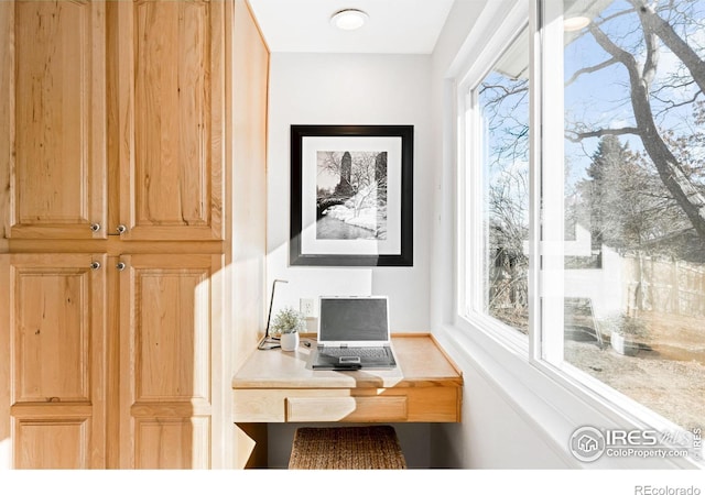 office area featuring built in desk and plenty of natural light