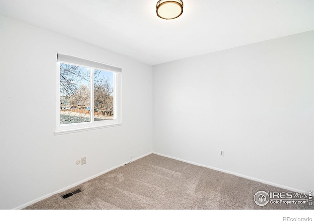 unfurnished room with carpet floors