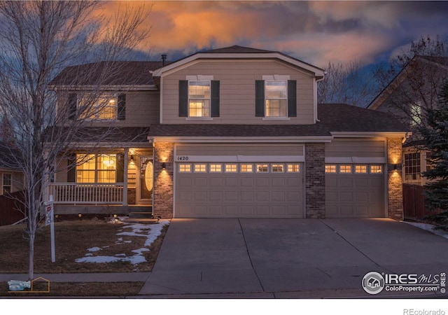 view of front of house with a garage and a porch