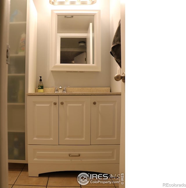 bathroom with vanity and tile patterned floors