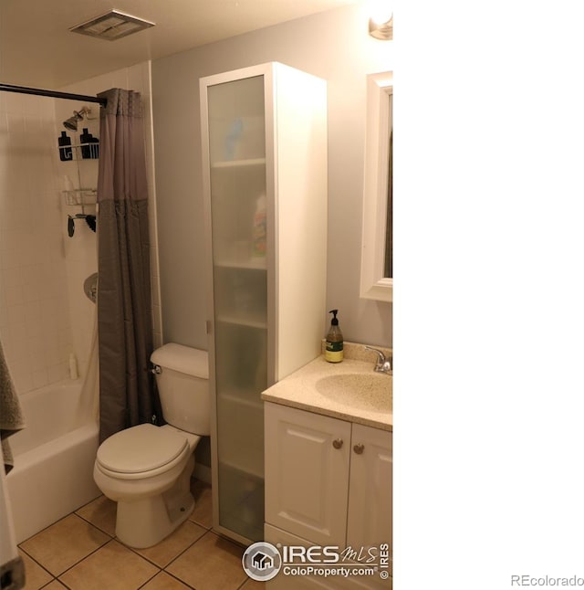 full bathroom with toilet, tile patterned flooring, vanity, and shower / tub combo with curtain