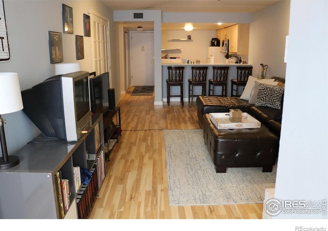 living room with light hardwood / wood-style floors