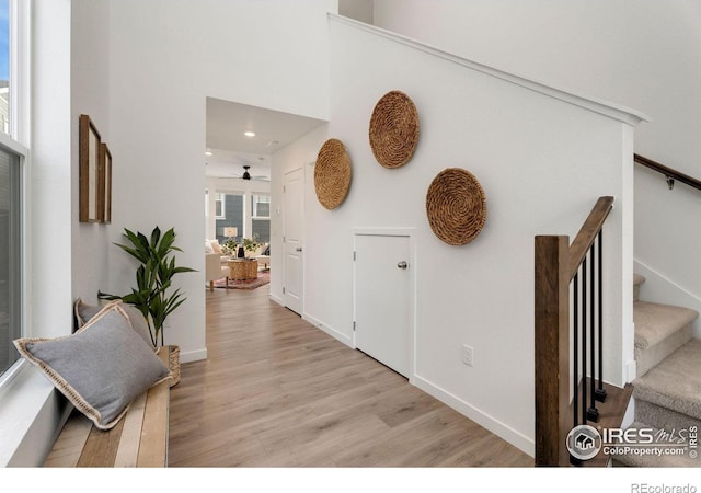 hallway with light hardwood / wood-style flooring