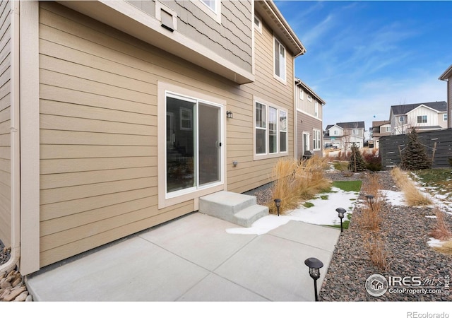 view of side of property with a patio area