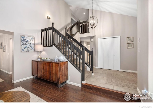 entrance foyer with a towering ceiling and a chandelier