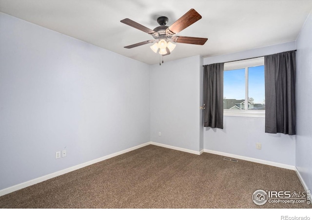 carpeted empty room with ceiling fan