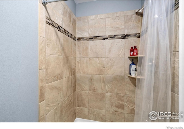 bathroom featuring a shower with curtain