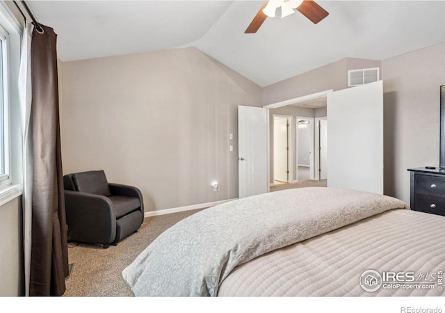 bedroom featuring ceiling fan, light colored carpet, and lofted ceiling