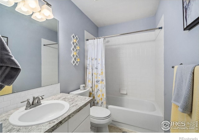 full bathroom with toilet, vanity, tasteful backsplash, and shower / tub combo with curtain