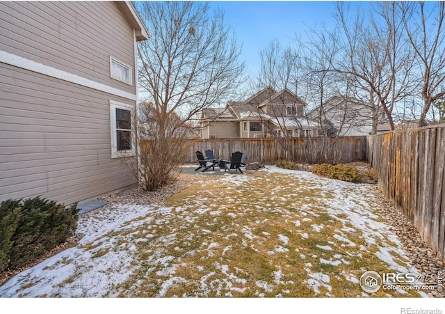 view of yard layered in snow