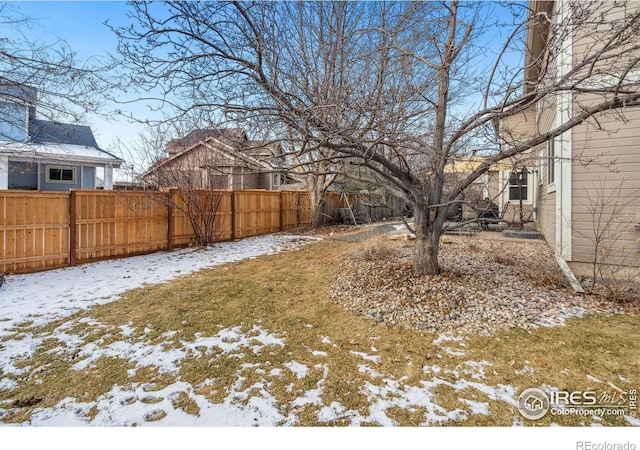 view of yard covered in snow