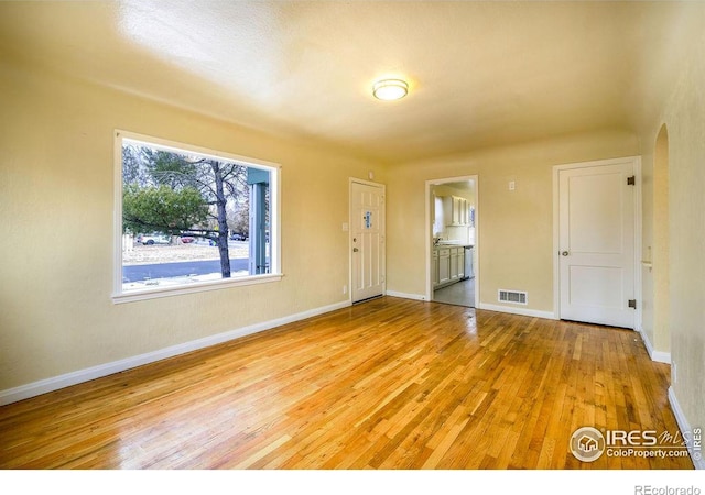 unfurnished room featuring light hardwood / wood-style floors