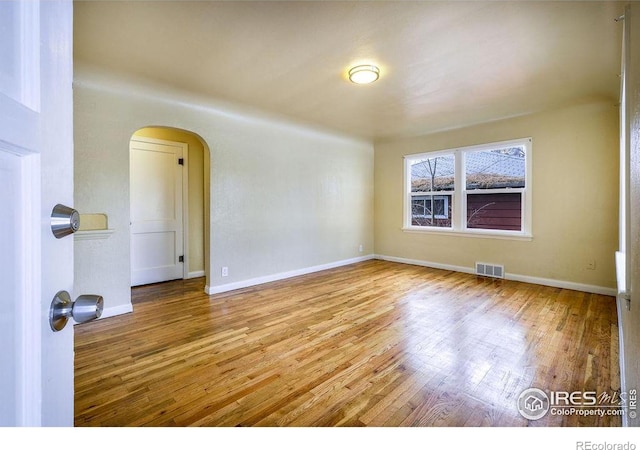 unfurnished room featuring light hardwood / wood-style floors