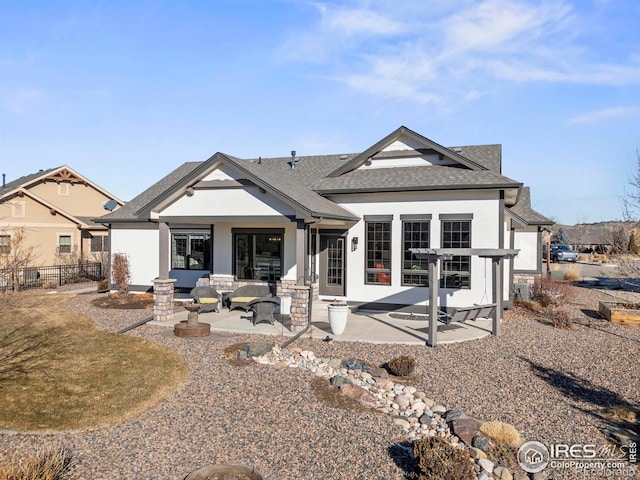 rear view of house with a patio