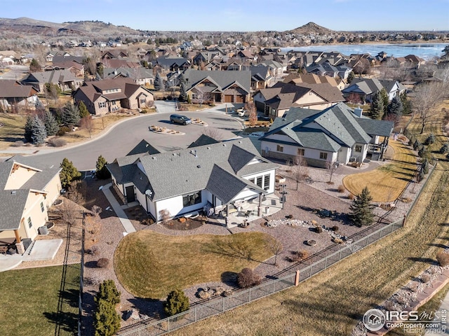 bird's eye view with a water and mountain view