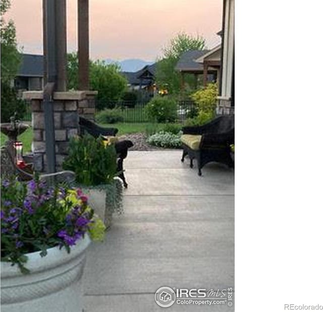 view of patio terrace at dusk