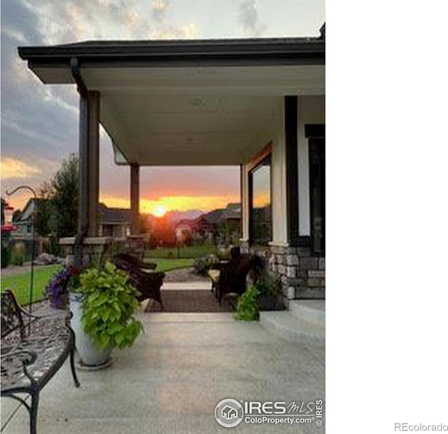 view of patio terrace at dusk