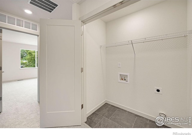 laundry area with washer hookup, electric dryer hookup, and dark carpet