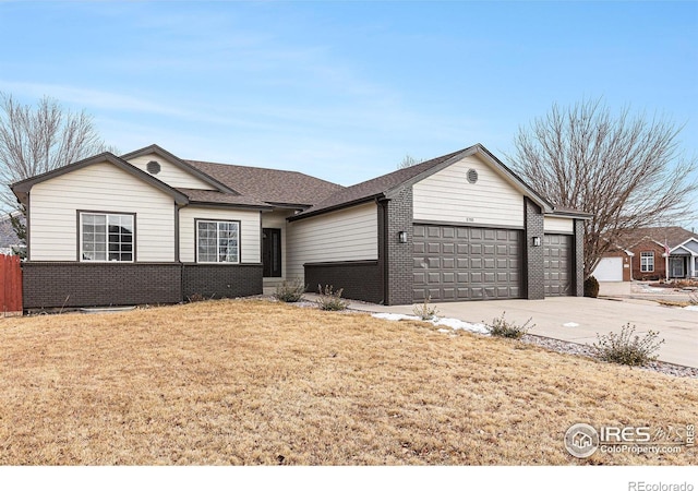 ranch-style home featuring a front yard and a garage