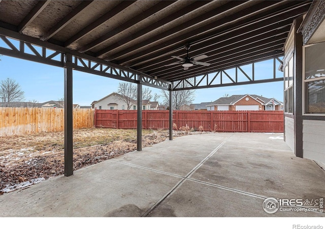 view of patio with a fenced backyard and a ceiling fan