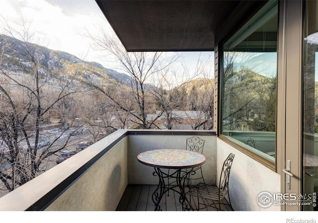 balcony featuring a mountain view