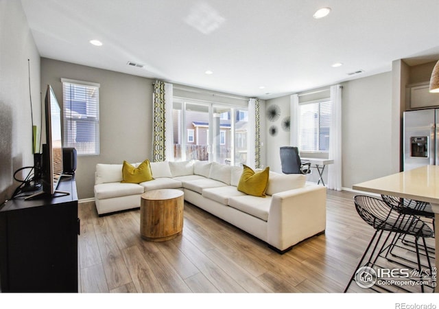 living room with light hardwood / wood-style floors