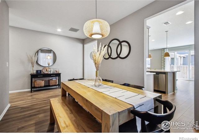 dining space featuring dark hardwood / wood-style floors