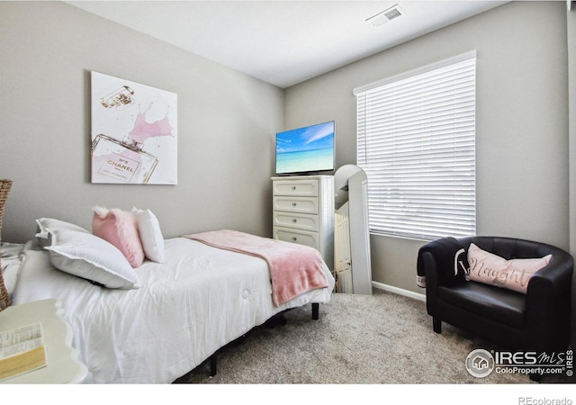 bedroom with light colored carpet