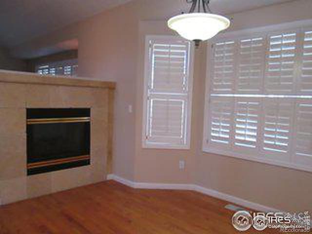 unfurnished living room featuring wood-type flooring