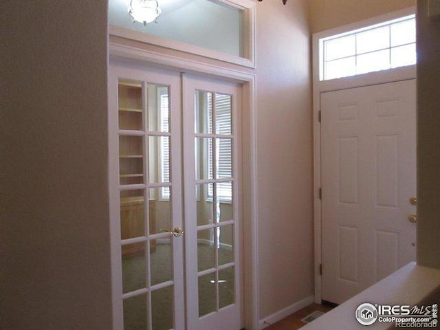 entryway featuring french doors