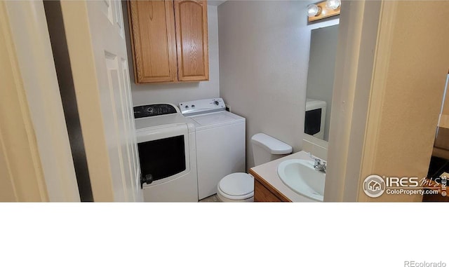 laundry room with washing machine and dryer and sink