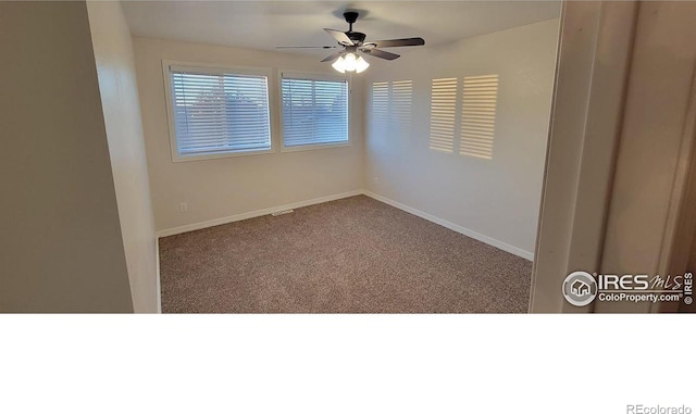 empty room featuring carpet flooring and ceiling fan