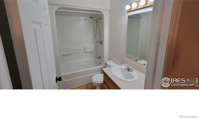 full bathroom featuring toilet, washtub / shower combination, and vanity