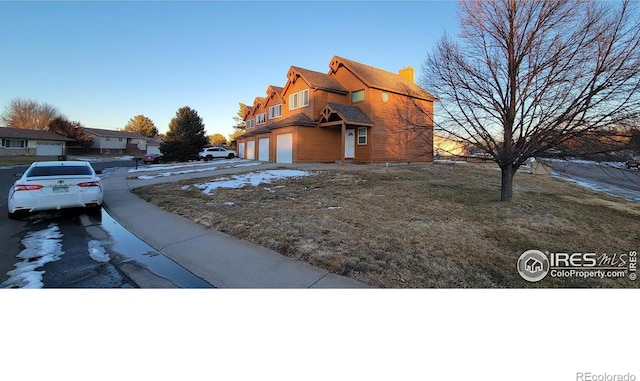 view of property exterior with a garage