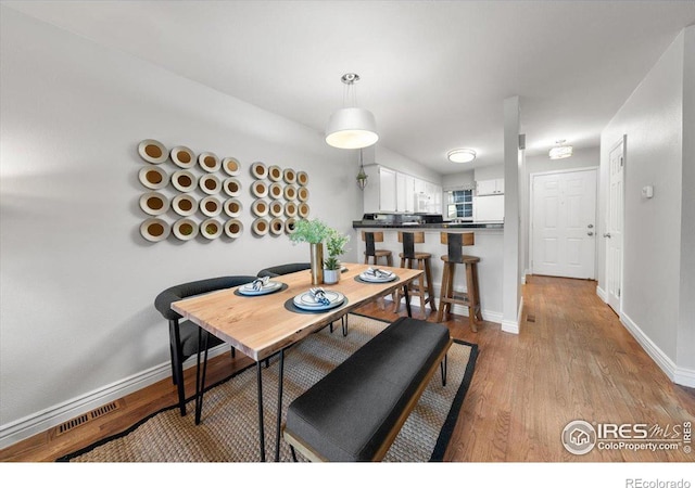 dining space featuring light hardwood / wood-style floors