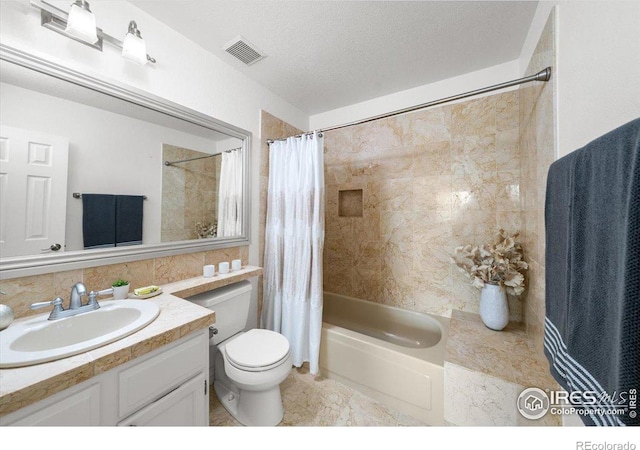 full bathroom with toilet, shower / bath combo, and vanity